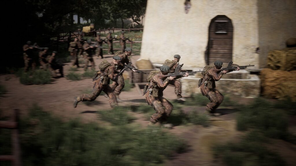 Headquarters: World War II demo screenshot: five commandos, each armed with a Bren, rush past a white windmill. 