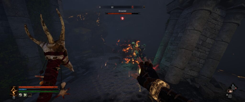 Tainted Grail: a spell generates a glowing runic bracelet on the right arm while a skull-topped staff is held in the left.