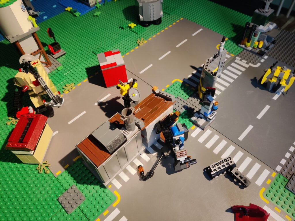 A bunch of Lego bricks on a Lego street.